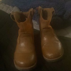 Brown cowboy boots! They are well loved but no holes anywhere